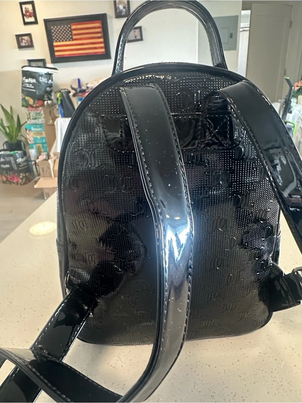 Juicy Couture Black Patent Mini Backpack, new without tags. Excellent condition.